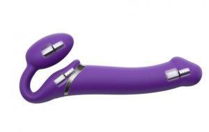 Purple vibrating dildo for mutual pleasure with clitoral stimulation