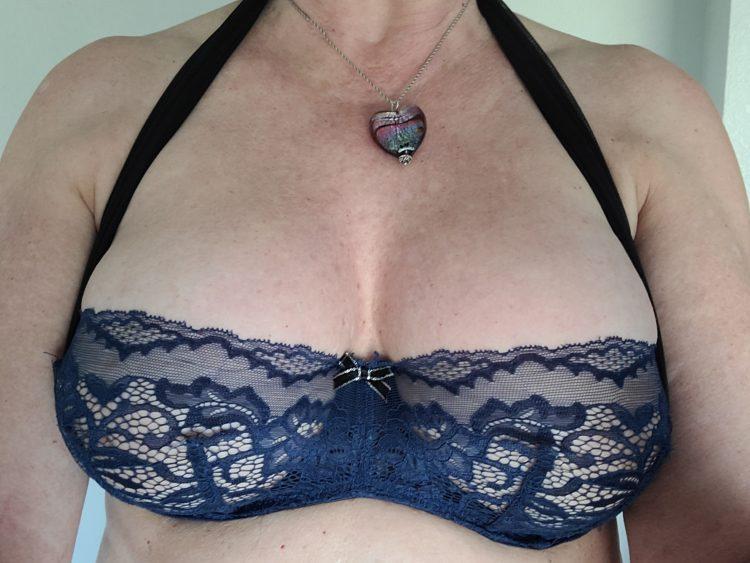 Ruby Ryder shares photo of herself wearing a blue lace low cut bra.