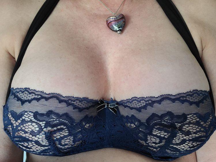 Ruby Ryder shares photo of her breasts wearing a blue lace low cut bra