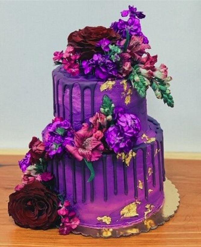 Ruby Ryder shares picture of 3 tiered purple cake decorated with flowers
